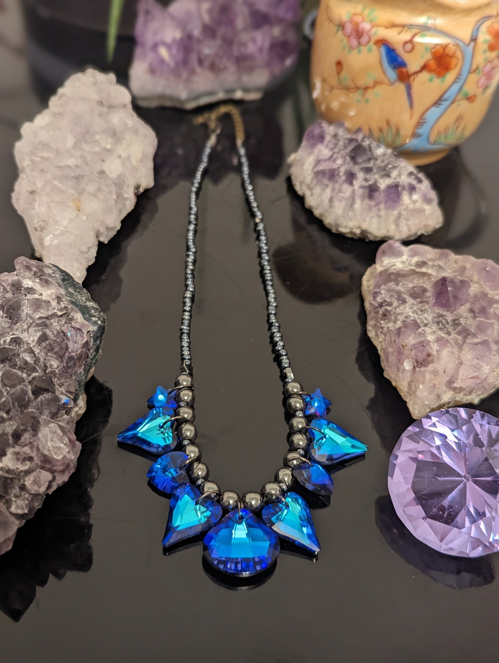 Night Love Composition: 9 Blue Heart, Star and Soft Triangle Pendants, Grey Hematite Styled Beads, Dark Blue Glass Beads.