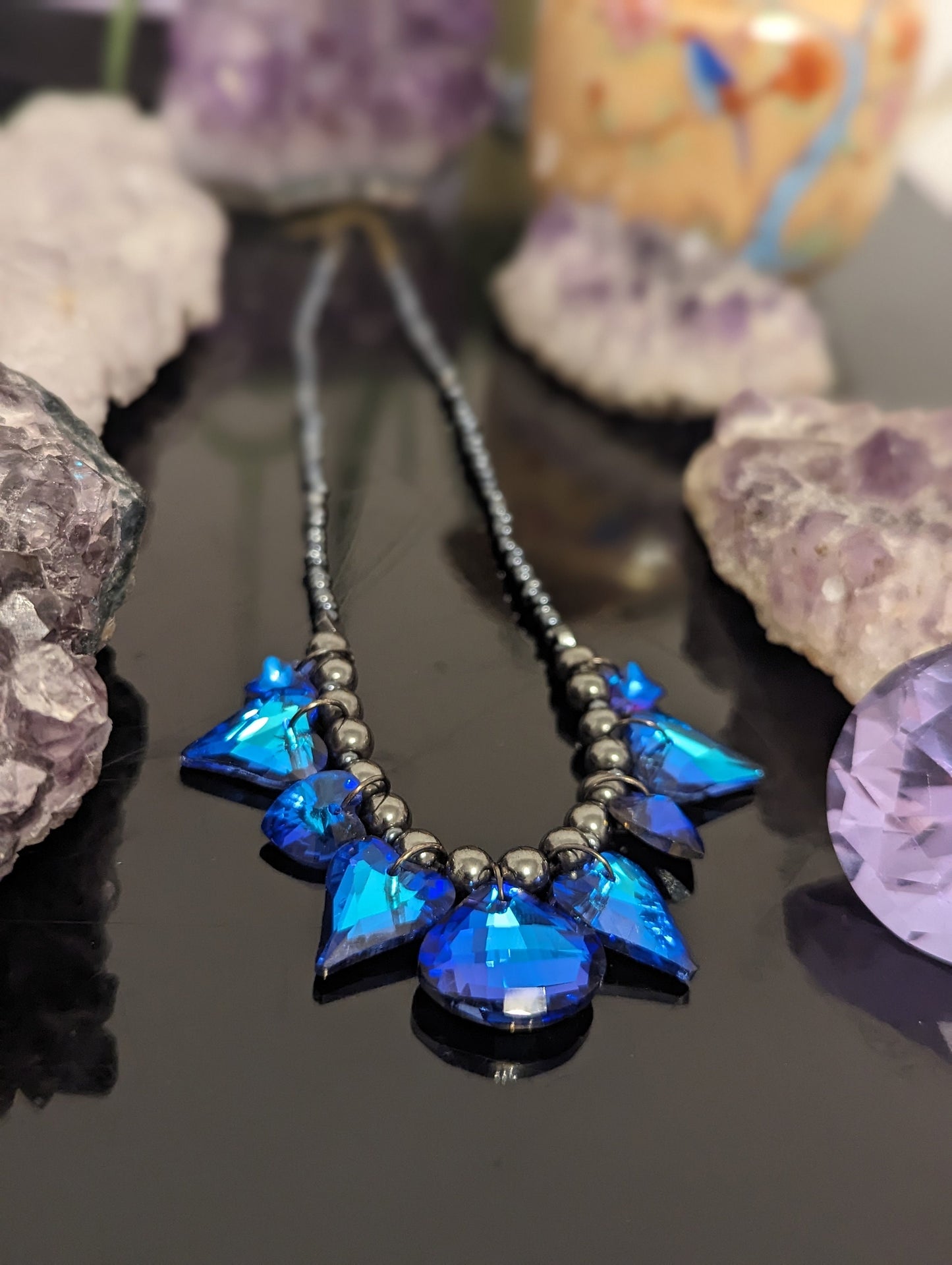 Night Love Composition: 9 Blue Heart, Star and Soft Triangle Pendants, Grey Hematite Styled Beads, Dark Blue Glass Beads.