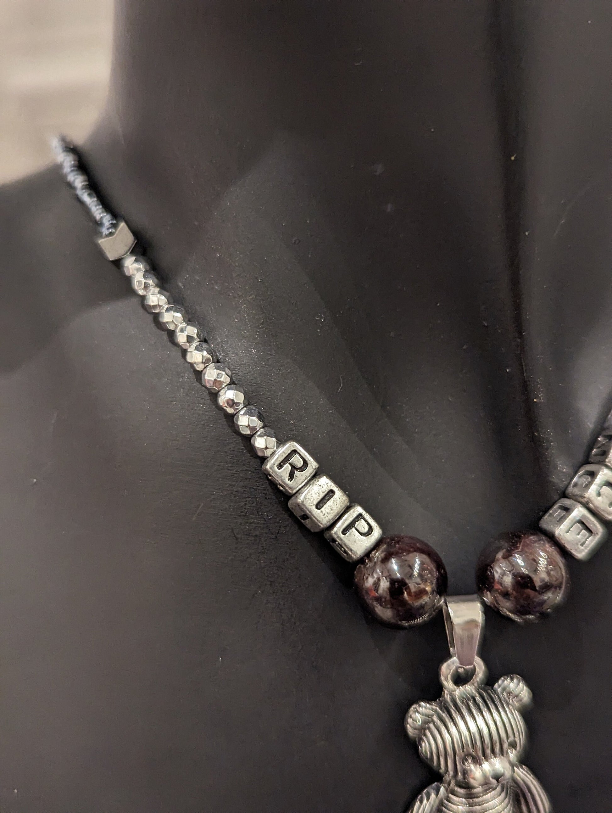 Dark Humor Series (1): Silver Teddy Bear Pendant with RIP INNOCENCE silver acrylic letters, Garnet Gemstones and glass beads