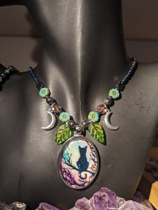 Black Cat on a Tree Branch, Purple Green Sky with Crescent Silver Moons, Green Leaf Pendants and Czech Crystal Flower Bracelet and Earrings