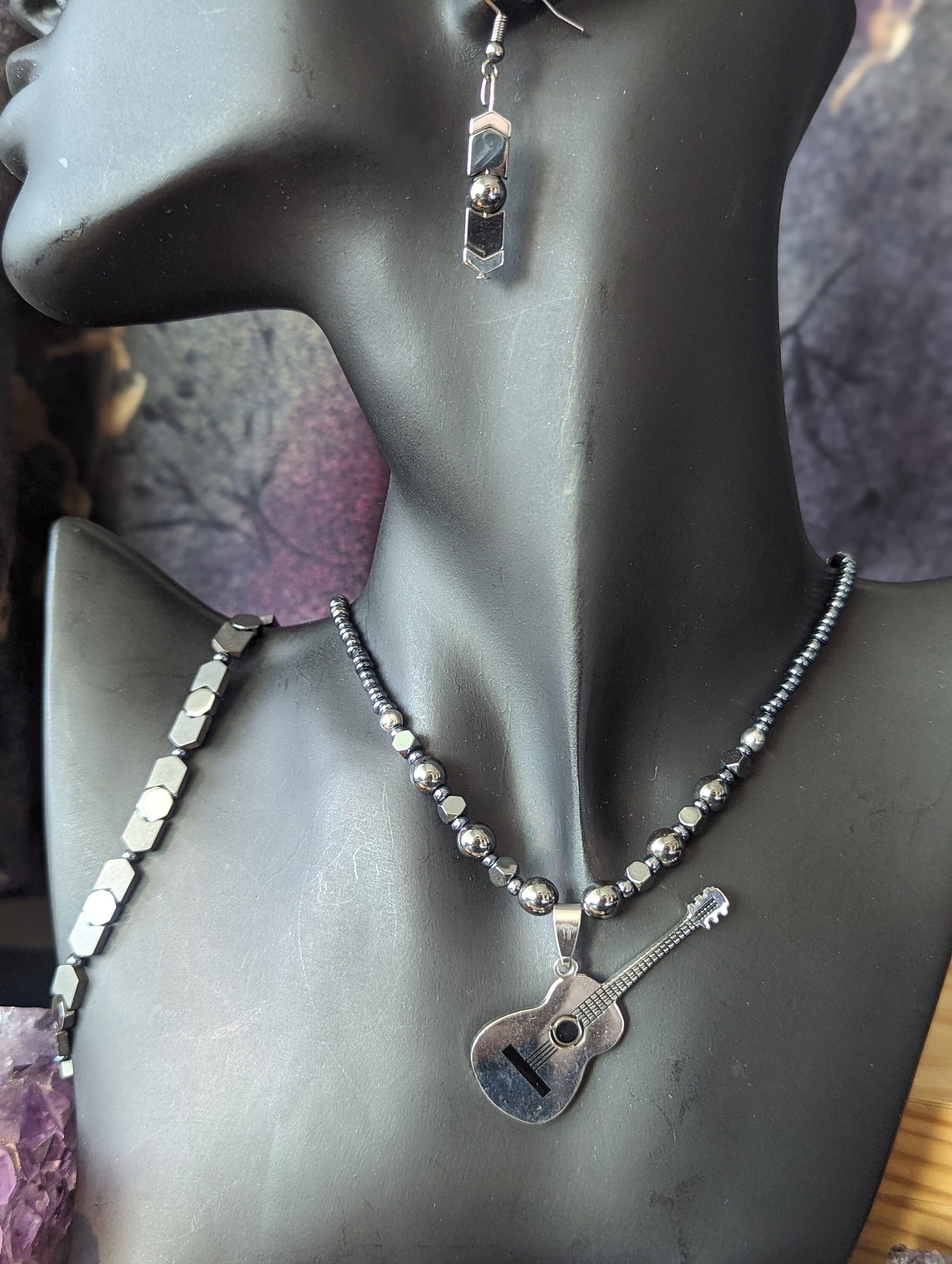 Silver Guitar Set: Silver Metallic Guitar Pendant, on a Silver Hematite Styled Beaded Necklace with Fitting Bracelet and Earrings