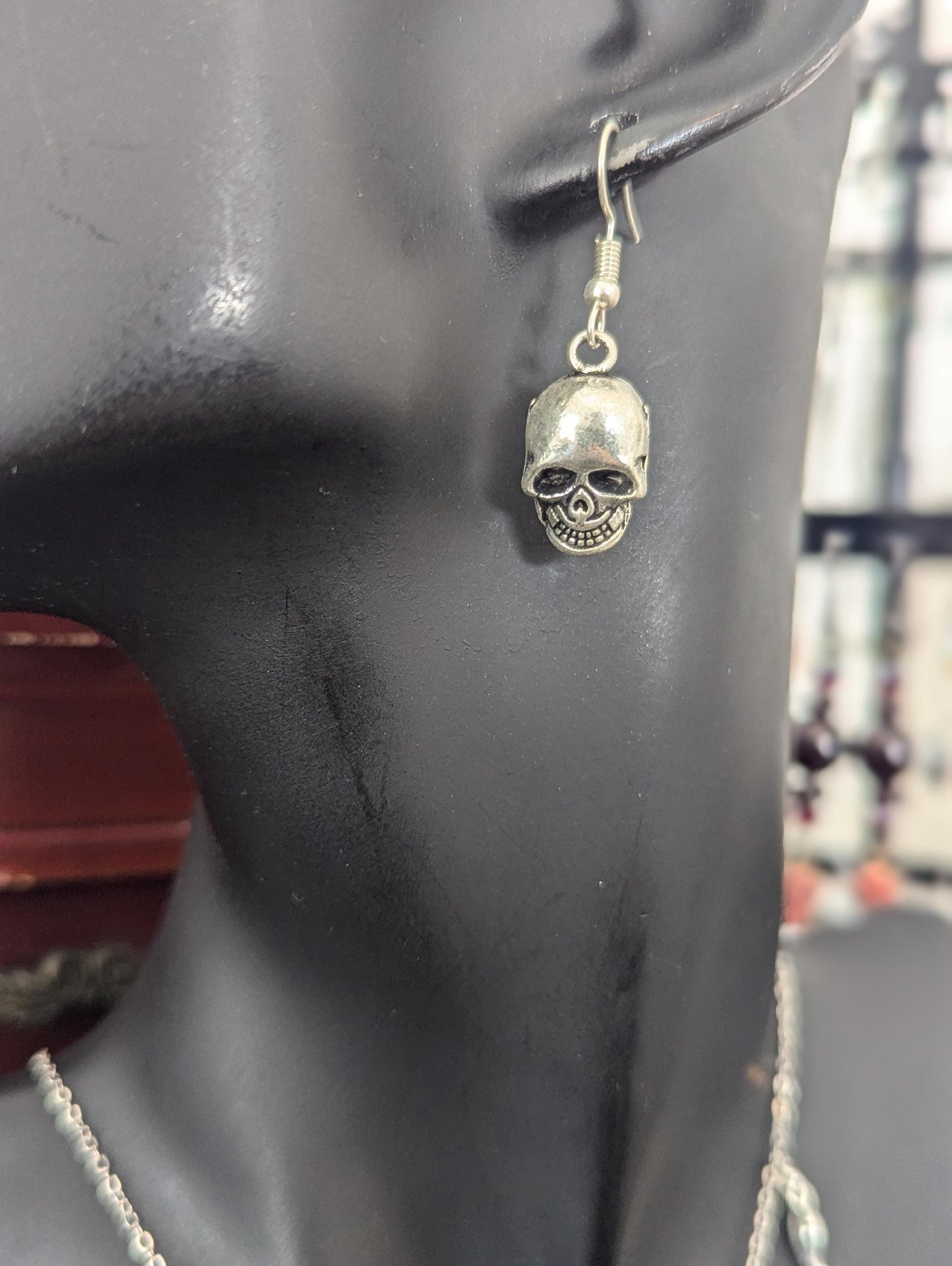 Silver Halloween Set. Made with silver snake, moon and jack-o'-lantern pendants on a silvery chain, silver grey bracelet and skull earrings