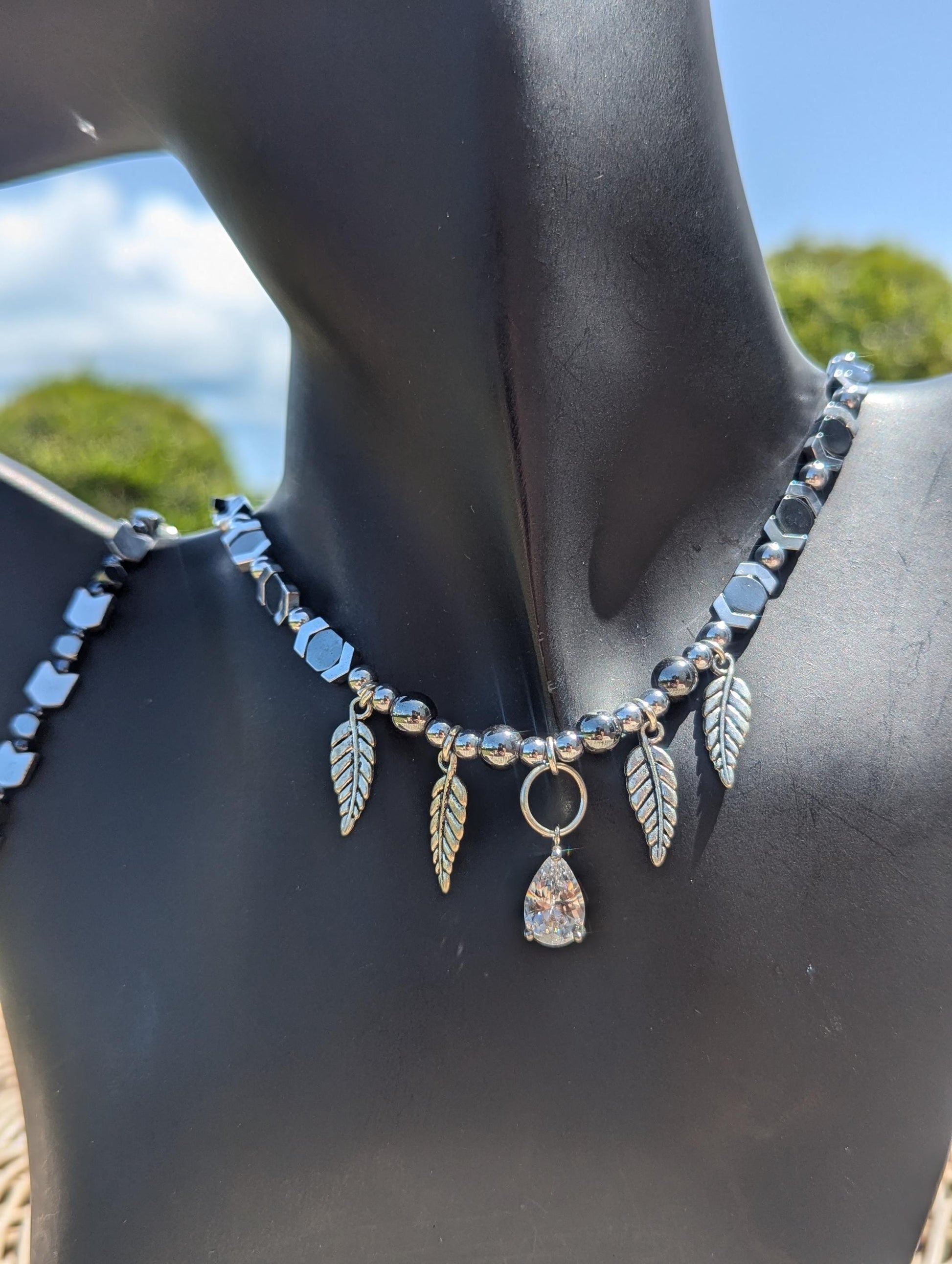 AMERICA East Coast. Zirconia Feathers Set: with silvery feathers and zircon earrings, beaded grey silver arrows bracelet