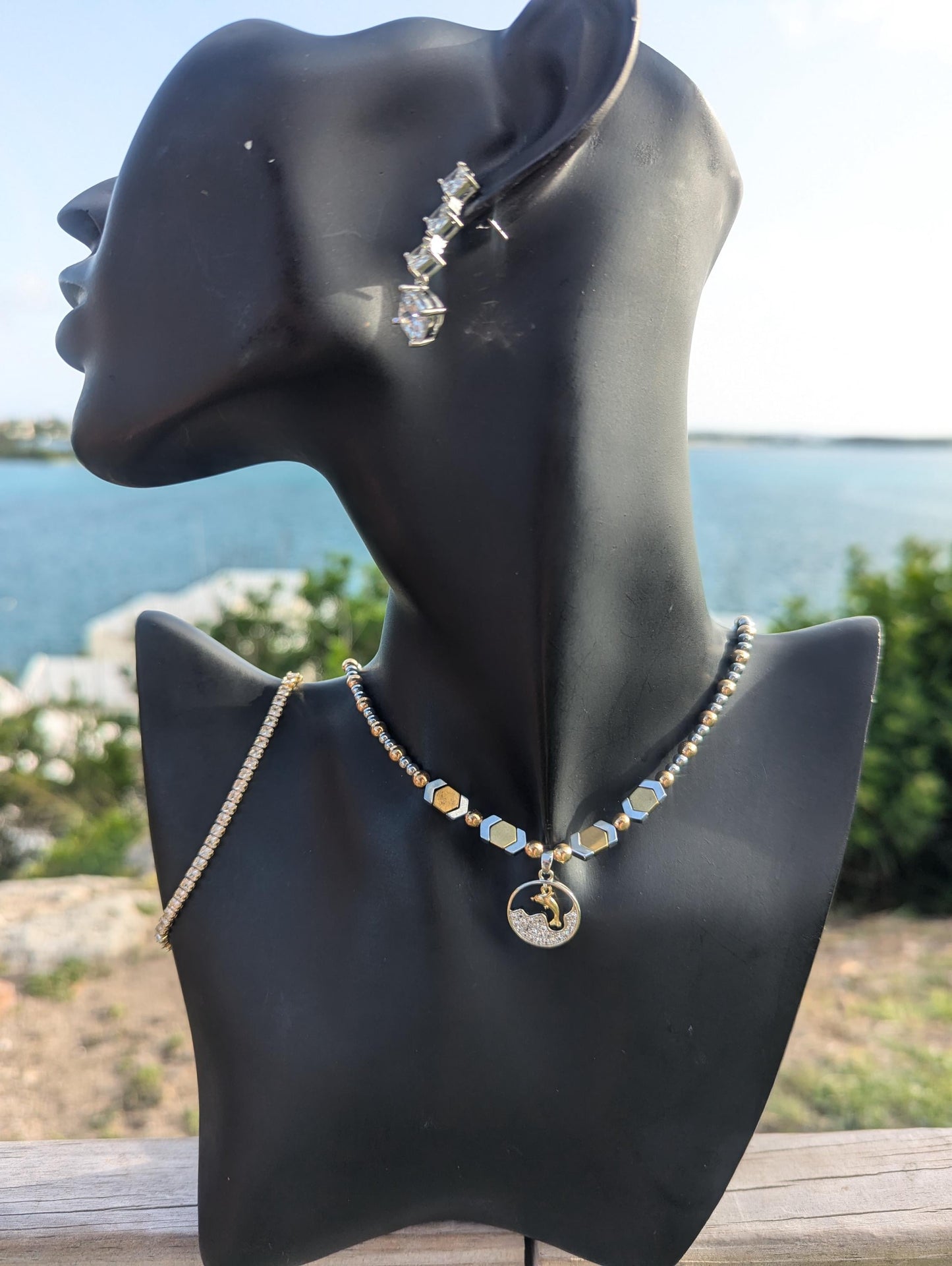 BERMUDA Gold Dolphin Set: gold dolphin and silver zircon round pendant with white zircon waves, gold and silver geometric beaded necklace