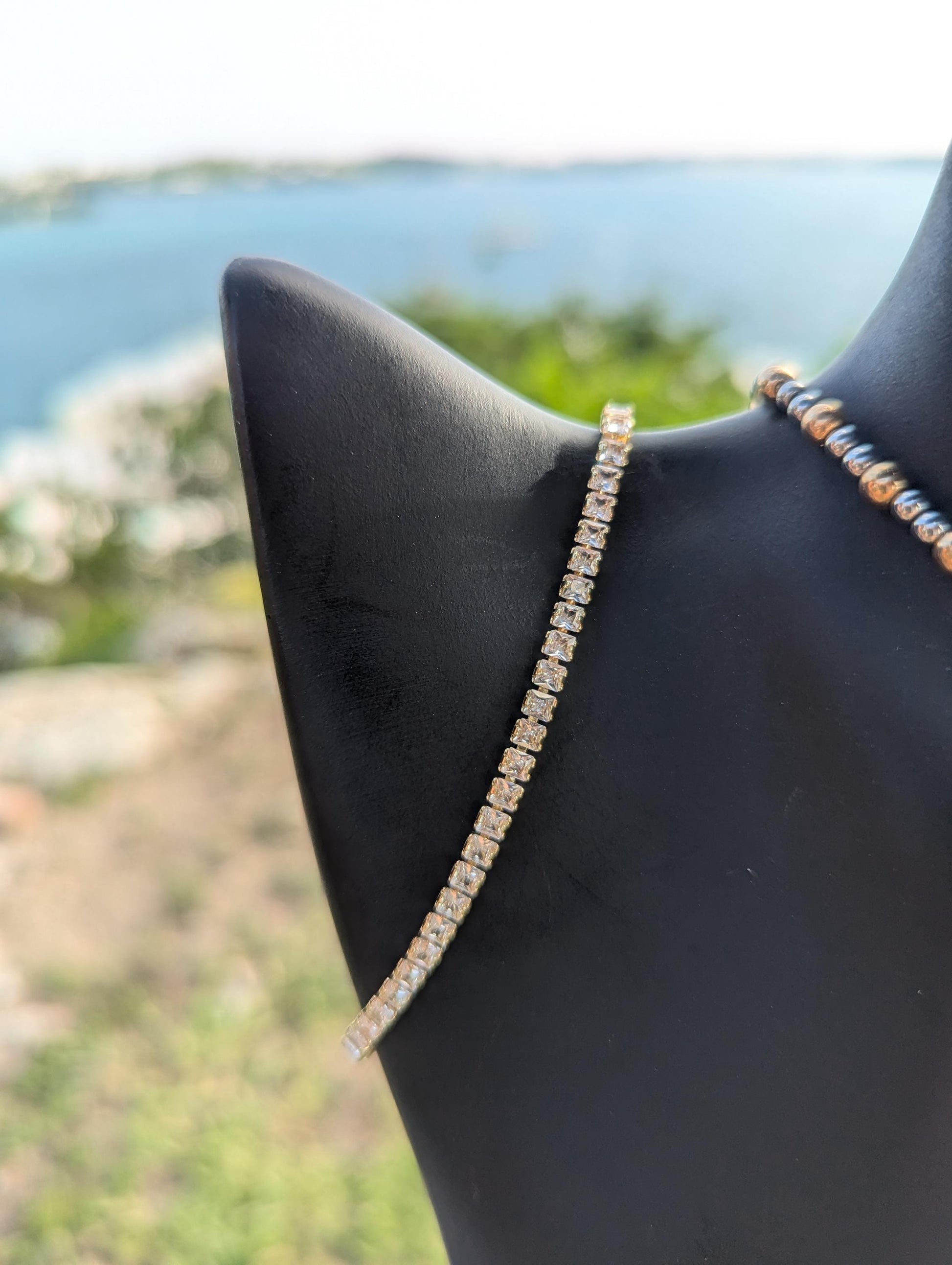 BERMUDA Gold Dolphin Set: gold dolphin and silver zircon round pendant with white zircon waves, gold and silver geometric beaded necklace