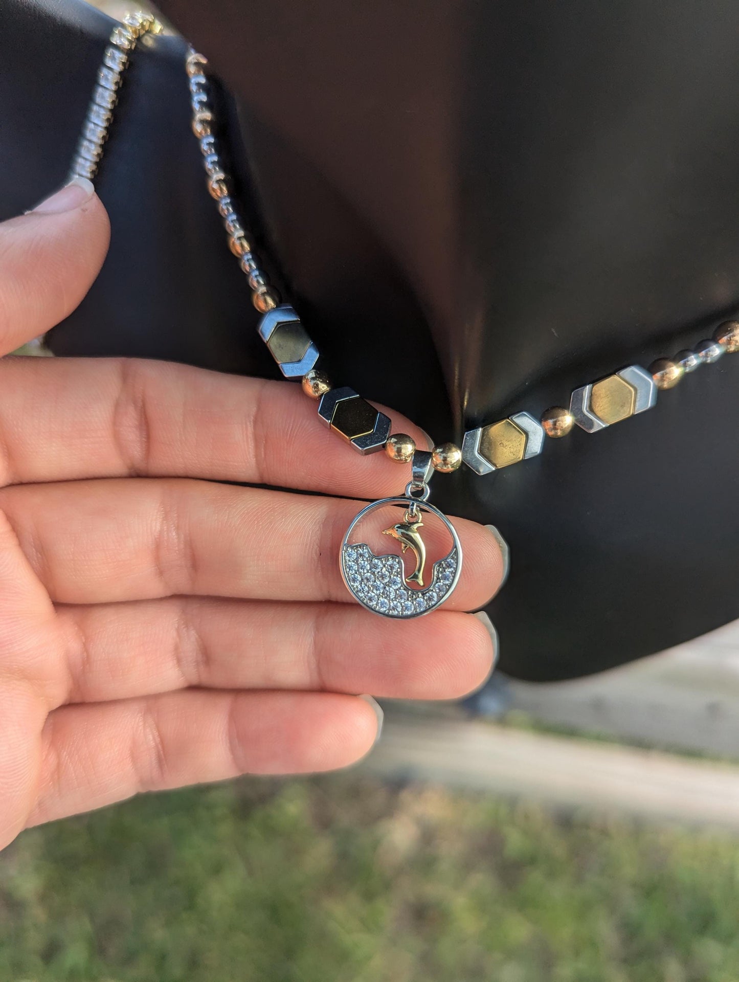 BERMUDA Gold Dolphin Set: gold dolphin and silver zircon round pendant with white zircon waves, gold and silver geometric beaded necklace